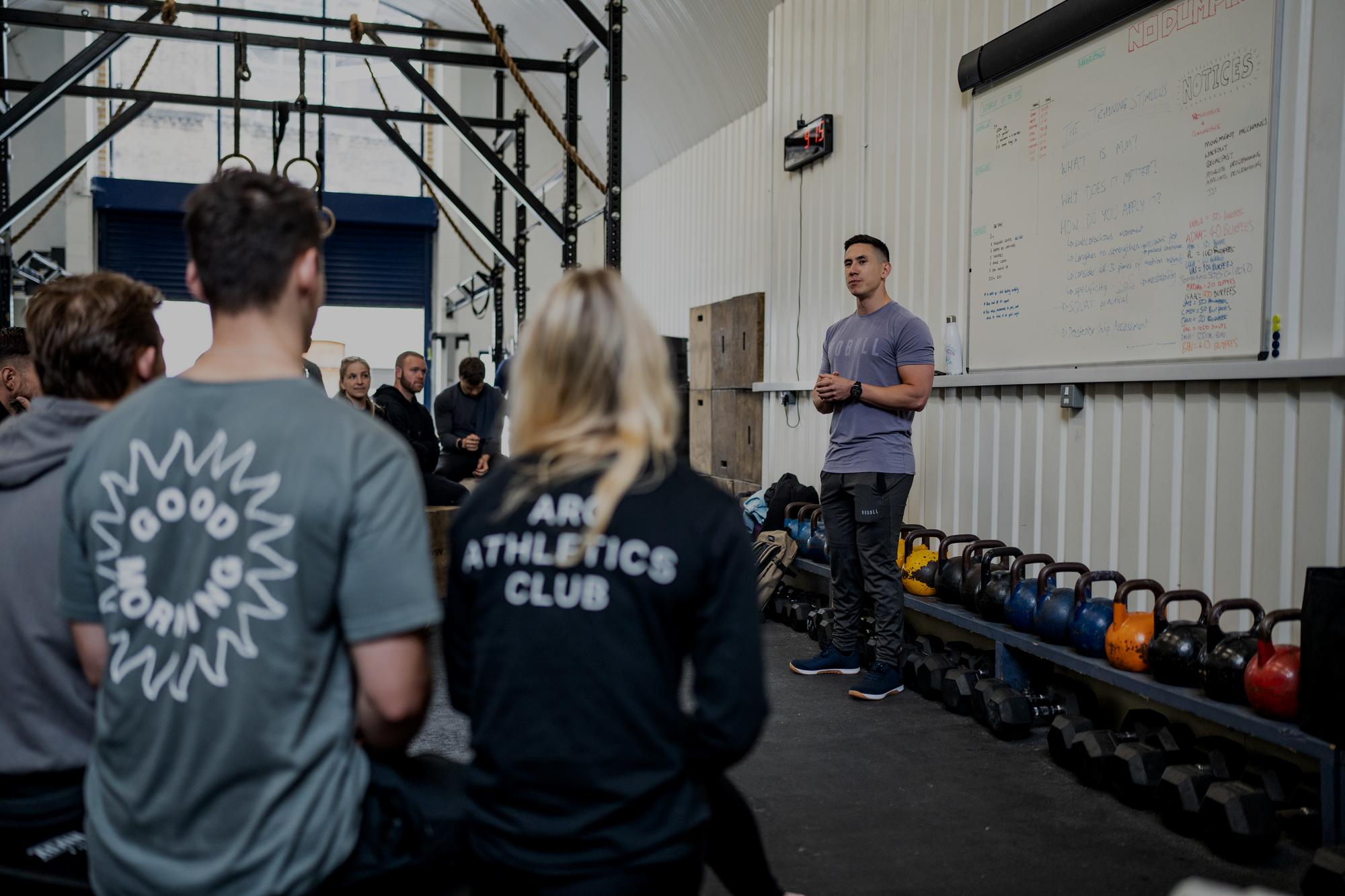 Ash Grossmann teaching a movement mechanics workshop to a group of coaches